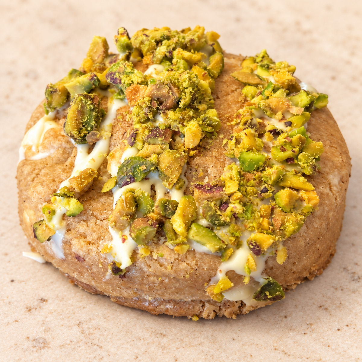 Pistachio Cream Crunch cookie on a cream background
